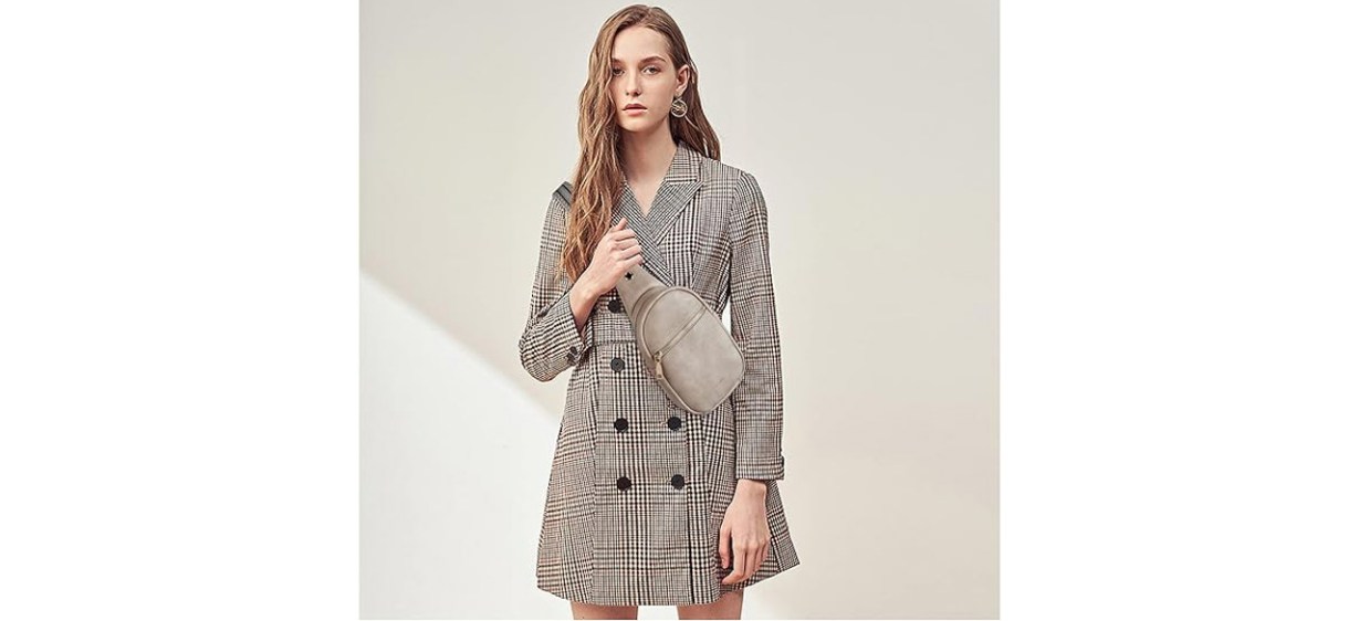 Woman holding Telena Small Sling Bag Woman holding Telena Small Sling Bag