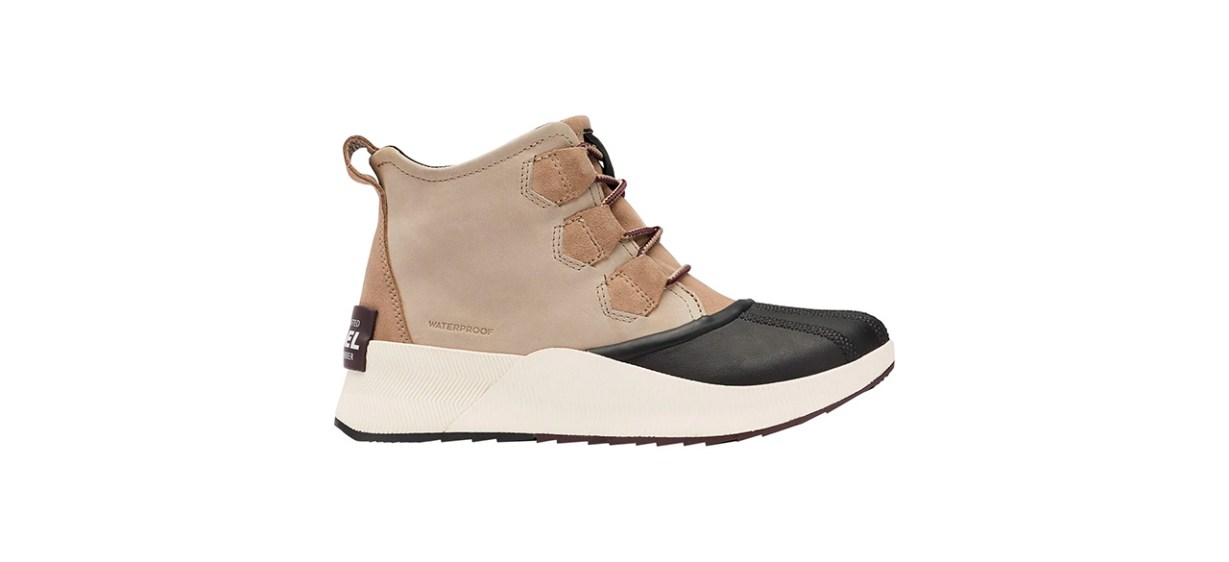 Tan duck boots with an ivory bottom and black rubber toe area