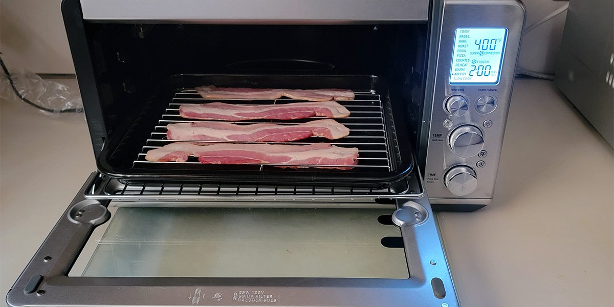 Breville Smart Oven Air Fryer with bacon on rack and open door Breville Smart Oven Air Fryer with bacon on rack and open door