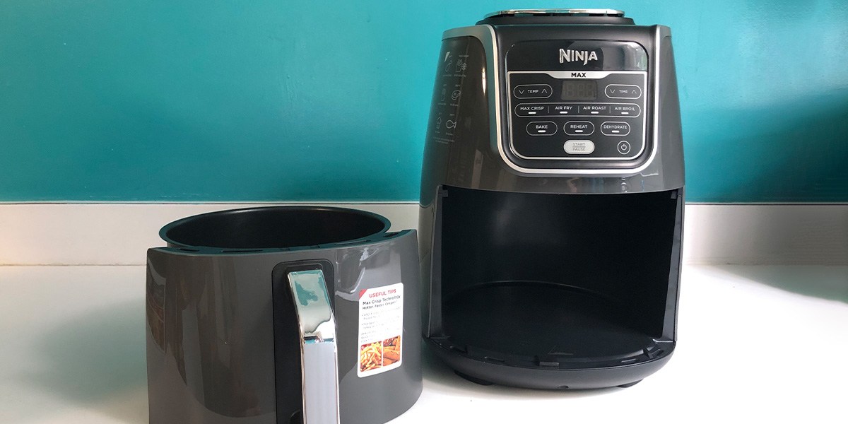 Ninja Air Fryer Max XL on counter next to cooking basket Ninja Air Fryer Max XL on counter next to cooking basket