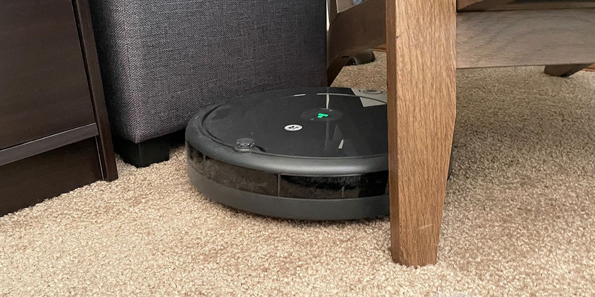 Roomba 692 on carpet next to chair leg Roomba 692 on carpet next to chair leg