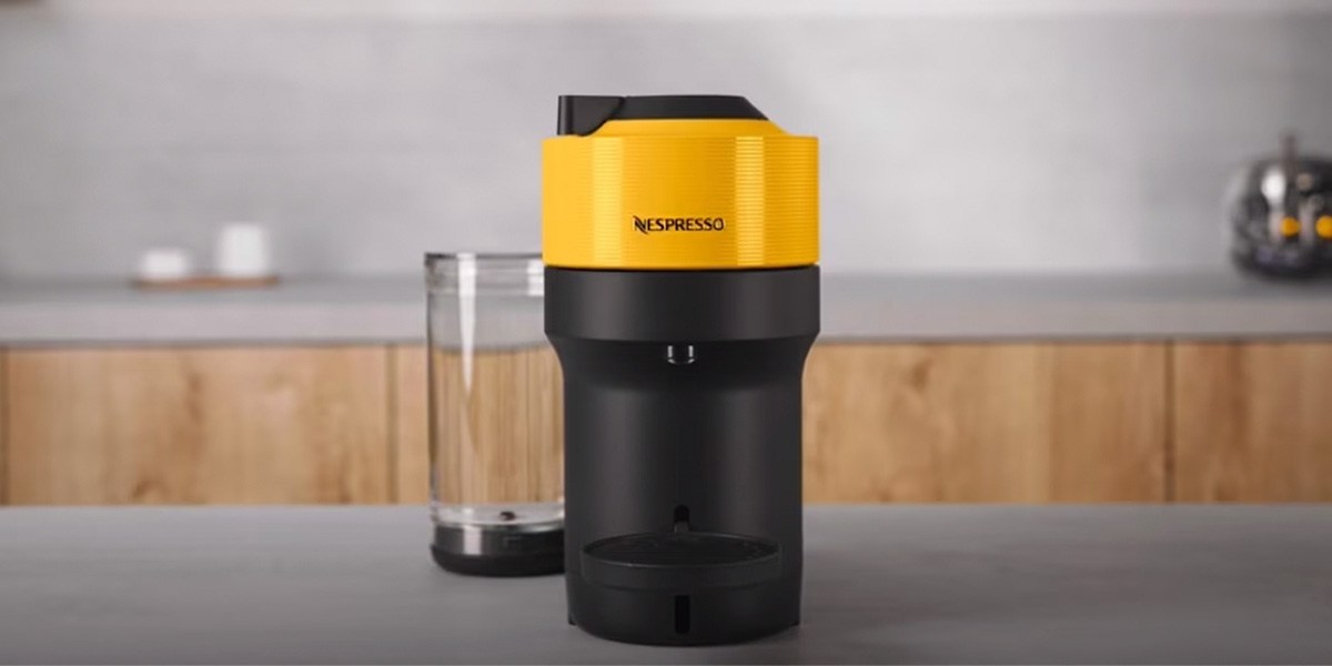 Yellow and black Nespresso Vertuo Pop+ on countertop