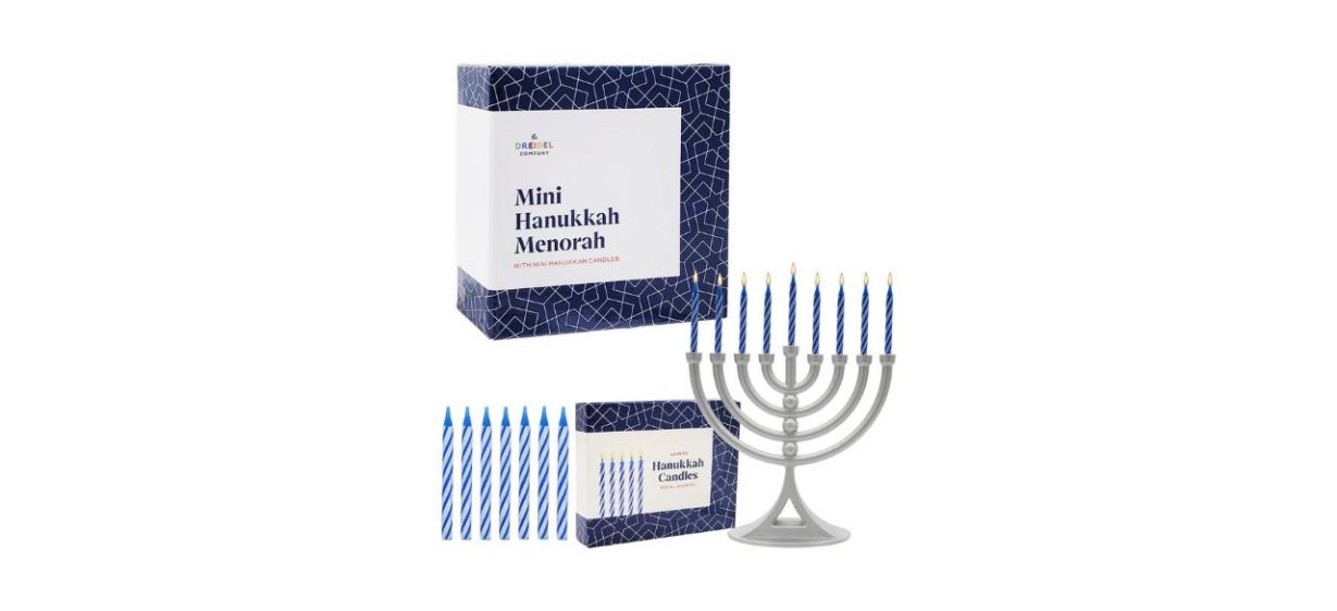 a silver mini menorah with blue candles a silver mini menorah with blue candles