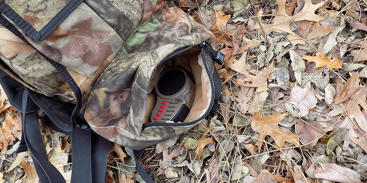 Cass Creek Ergo Predator Call in camo backpack on ground
