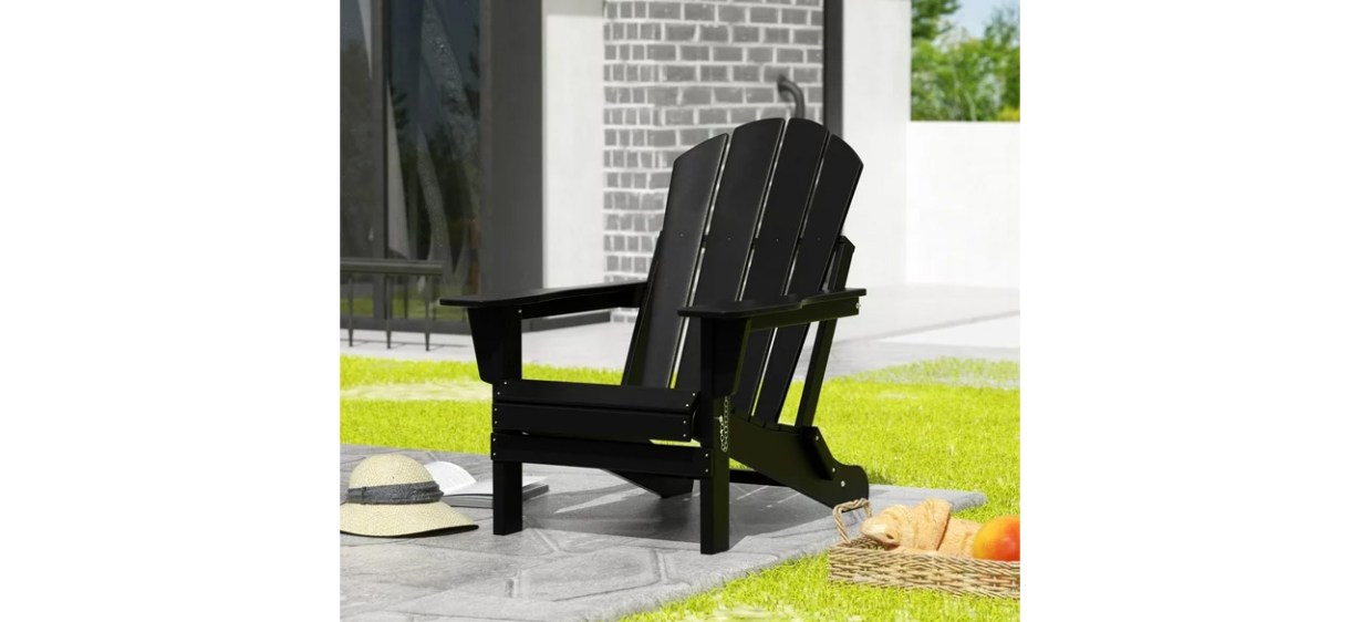 Westintrends Outdoor Folding HDPE Adirondack Chair in back yard