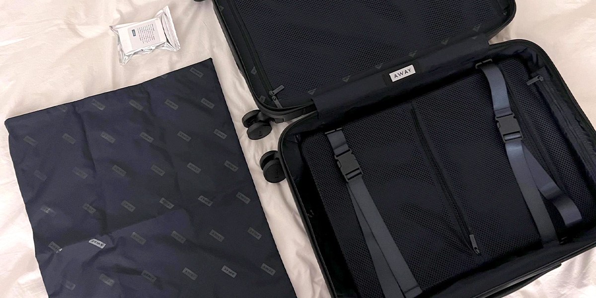 Away Carry-On open on bed