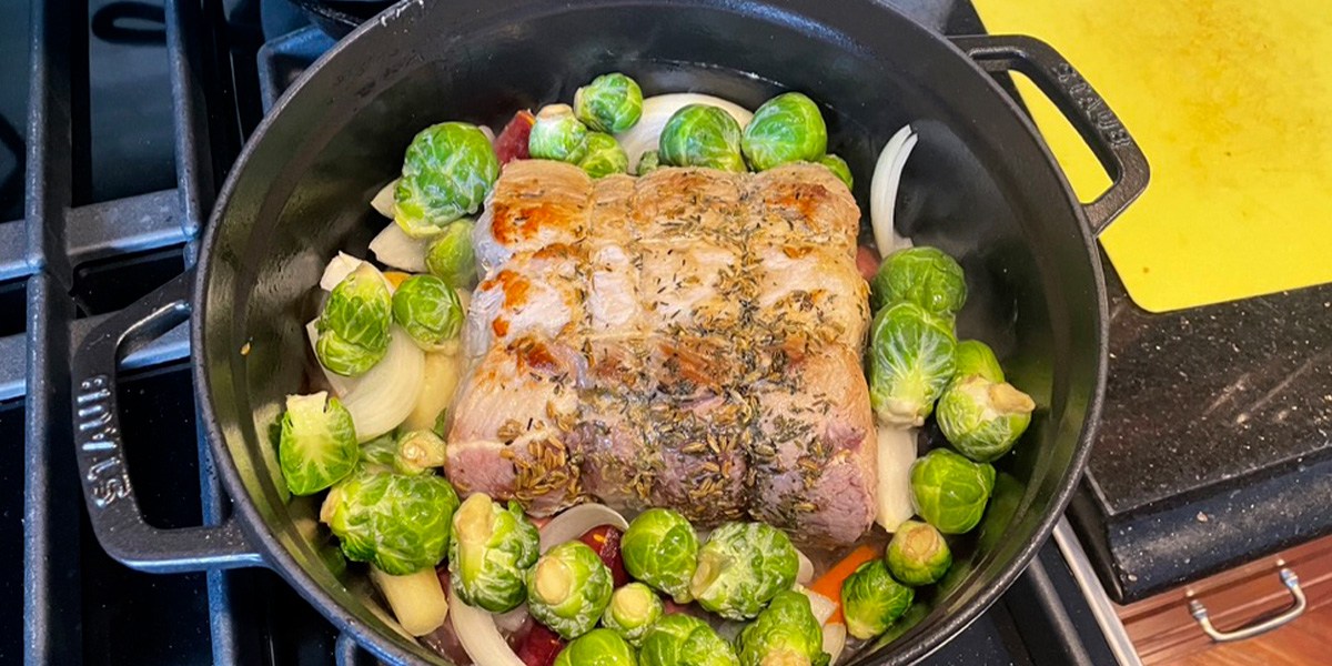 Staub Cast Iron Dutch Oven with meat and veggies inside