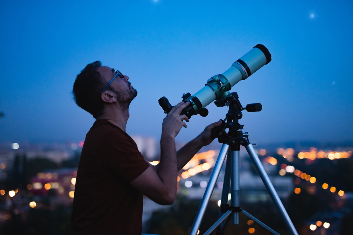 a man with a telescope