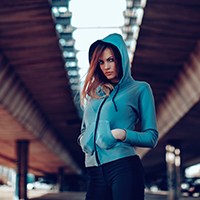 a woman in a green hoodie